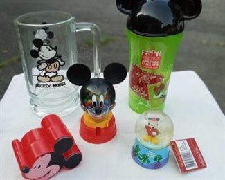 Lot Number:	315
Lead:	Disney Mickey Mouse Lot 5- new items
Description:	items unused glass mug, small snow globe, small Skittles dispenser, plastic storage case, & green plastic drinking glass