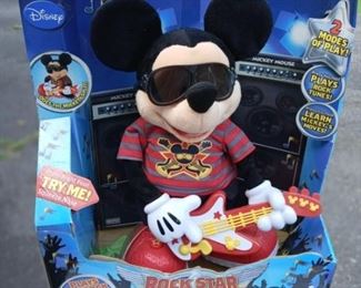 Lot Number:	314
Lead:	Disney Rock Star Mickey- New in Box
Description:	Fisher Price; 2011 16" Tall