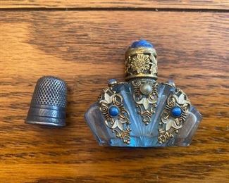Miniature perfume bottle (thimble for size)
