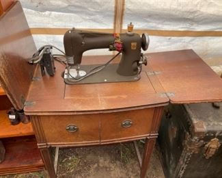 Antique Montgomery Ward sewing machine in cabinet