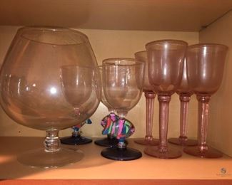 Wine Glasses
Four (4) pink glasses and three (3) plastic fish glasses. Plastic is cracked in some places from wear. Also includes one (1) large extra large glass goblet.