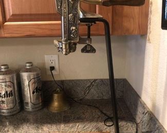 Fancy Bottle Opener
Beautiful metal and wooden wine bottle opener. Measures 24"Hx7"Wx11"D