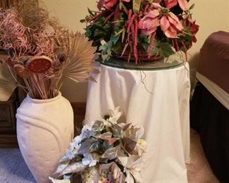 Side Table and Florals
Small round side table with glass topper - three (3) extras glass pieces included. 26" tall, 20" round. Ceramic, basket and stone floral vases.