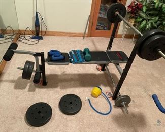 Workout Bench
One (1) Weider 155 workout bench 40"H x 69"W x 59"D with bar. Includes four (4) 15 pound weights and four (4) 10 pound weights. Comes with extra dumbbell with four (4) 10 pound weights. Two (2) Weider ankle weights, weight unknown, and more.