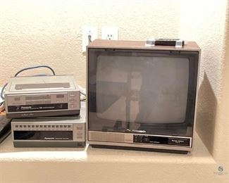 Panasonic Electronics
One (1) vintage Panasonic Compufocus TV, 13.5"H x 13"W x 15"D. Includes remote control. Powers on. One (1) Omnivision portable cassette recorder. Comes with one (1) programmable tuner. Powers on.