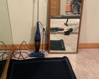 Vacuum and Mirror
One (1) Bissell vacuum. Powers on but needs cleaning. One (1) outdoor floor mat. One (1) wood framed mirror, 38"H x 19"W.