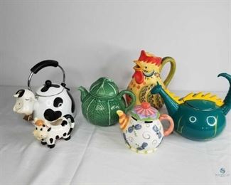 Tea Pots and More
Four (4) tea pots and one (1) water pitcher and one (1) creamer. No apparent chips or cracks