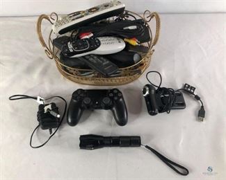 Remotes and Assorted Cables
Includes a PlayStation controller, various remotes, a web cam and misc. cables. The lot is yours!