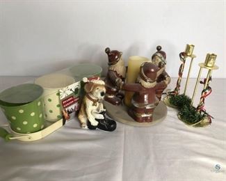 Christmas Decorations
Santa candle holder, brass colored candle holders, a Christmas puppy and decorative enamel tins