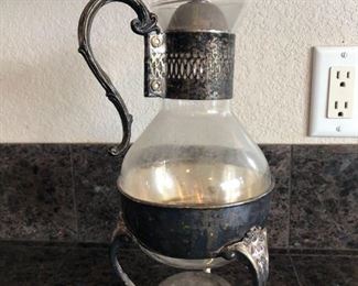 Coffee Carafe
Glass and silver-plate coffee or tea carafe with warming plate.