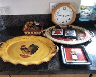Assorted Kitchen Trays, Decoration and Trivets
Includes large and small serving platters, a clock and a basket.