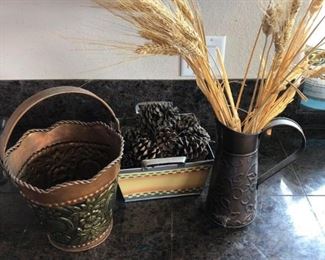 Nature Decoration
Wheat stalks and pine cones in metal basket and pitcher. Also includes an additional basket