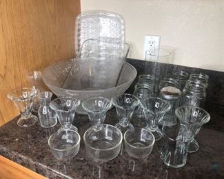 Assorted Glassware
Assorted glassware. Includes ice cream cups, mason jars and more. Large bowl and platter are plastic not glass.