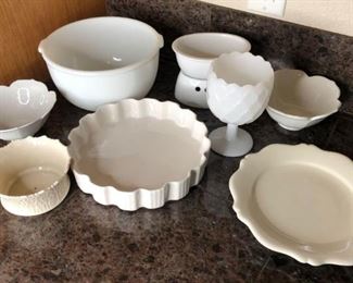 White Dishes
White dishes. Including one (1) mixing bowl, one (1) milk glass cup, two (2) flower shaped bowls and more.