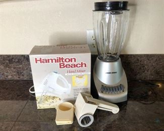 Blender, Mixer, and More
One (1) Hamilton Beach hand mixer in box. Missing beaters, untested. One (1) Black n' Decker Blender, untested. One (1) Pampered Chef shredder. One (1) mix of measuring cups.