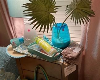 Beach-themed goodies, including lamp, beach bag, prints