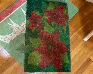 One Christmas door mat and one Christmas kitchen sink rug 