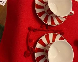 Pair red and white stripe coffee cups with saucers 