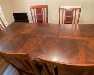 dining table with extra leaf and pads, excellent condition, 6 chairs 