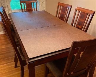 dining table with extra leaf and pads, excellent condition, 6 chairs 