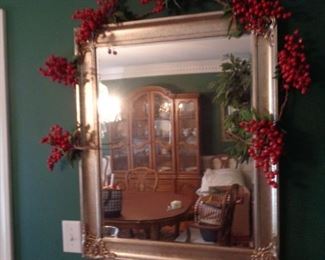 Mirror in dining room with berry decor