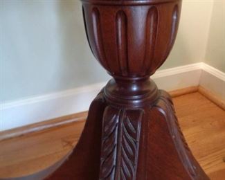 carved detail of round table