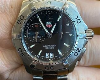 Men's Tag Heuer Aquaracer quartz watch with stainless steel band. Serial number WAF111Z 