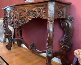 Intricate hand carved imported wood table