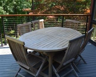 AMAZING OUTDOOR TEAK TABLE AND 6 CHAIRS WITH BUILT IN LEAF