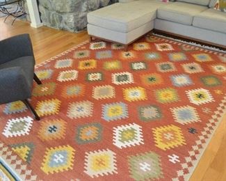 Isara Red/Mulit Kilim:  https://www.interiorhomescapes.com/Isara-Collection--Red-Multi--7-6-x-9-6_p_57170.html 