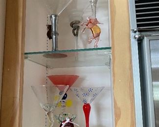 Many fabulous handcrafted  martini glasses.