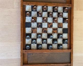 Antique folk art checker board with Djaya pieces