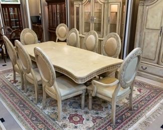 This beautiful formal dining set comes with 10 chairs!  With two leaves, it measures approximately 102" x 45".  Sold separately is a matching hutch, and separate cabinet.  All in excellent condition.  We have two large area rugs like the pictured 13' x 9.3' and 7.5' x 11.  