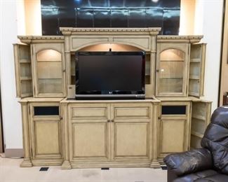 This 110"  Home Center is amazing! Using a remote control, the TV can stay hidden until you are ready to watch.  This TV is included with the home center.