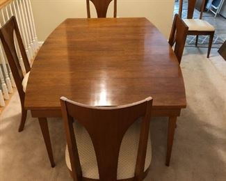 Mid-Century Modern Walnut Jordan Marsh Dining Table & 5 Chairs with 2 additional leaves: Table - 29Hx66Wx42D, Chairs - 37Hx20Wx19D, 2 Leaves each 42Dx18W