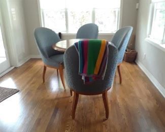 Small scale dining table and four blue upholstered chairs