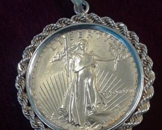 14k bezel, coin is in fair to good condition