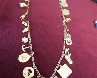  Charm necklace is a mix of 10k, 12k, and 14k charms on 14k chain. A few are unmarked.