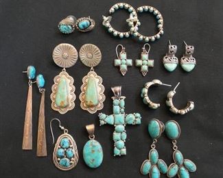 A varied selection of silver and turquoise earrings and ross pendant.