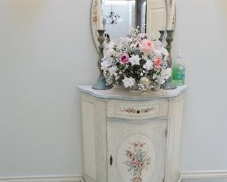 Shabby chic small cabinet and oval mirror.