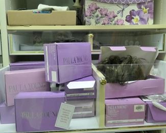 New and nearly new wigs and hairpieces in boxes. Dark colors.
