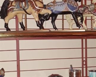 And there are small horses and large piggy banks on this large and stout brass baker's racks. A good one. Must see.