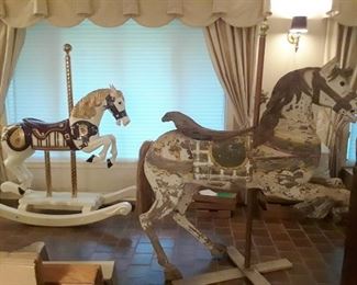 Two large carousel horses. The rocker in back is obviously new. You be the judge of the one in front.