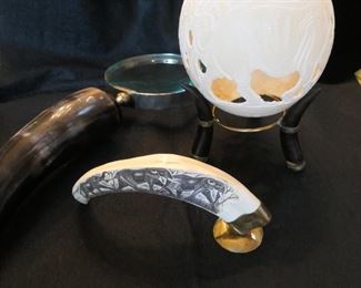Large magnifying glass with horn handle, carved tusk, carved ostrich egg. African.