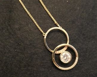 1.85 ct center diamond with small diamonds at top and lower section. 14k. Appraisal with purchase.