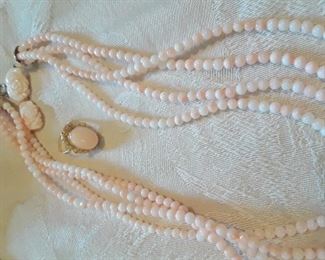 Angel skin coral four strand necklace and ring.