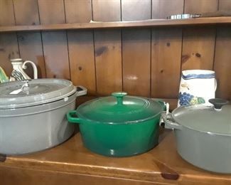 Enameled cast iron cooking pot. At left is an exceptionally large pot or Dutch Oven.