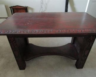 Burnished red finished desk. Unusual. See next photo for carved details.