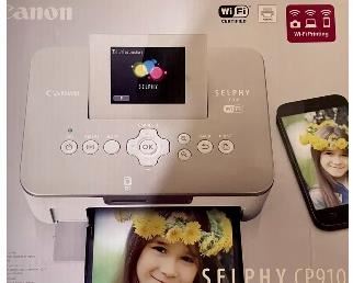 Canon Selphy photo printer with 2 boxes of ink and paper!