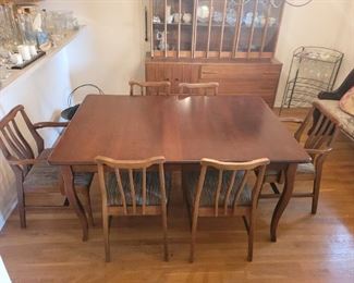$400.00, Cherry dining room set with a slightly MCM line, excellent condition self storing leaves